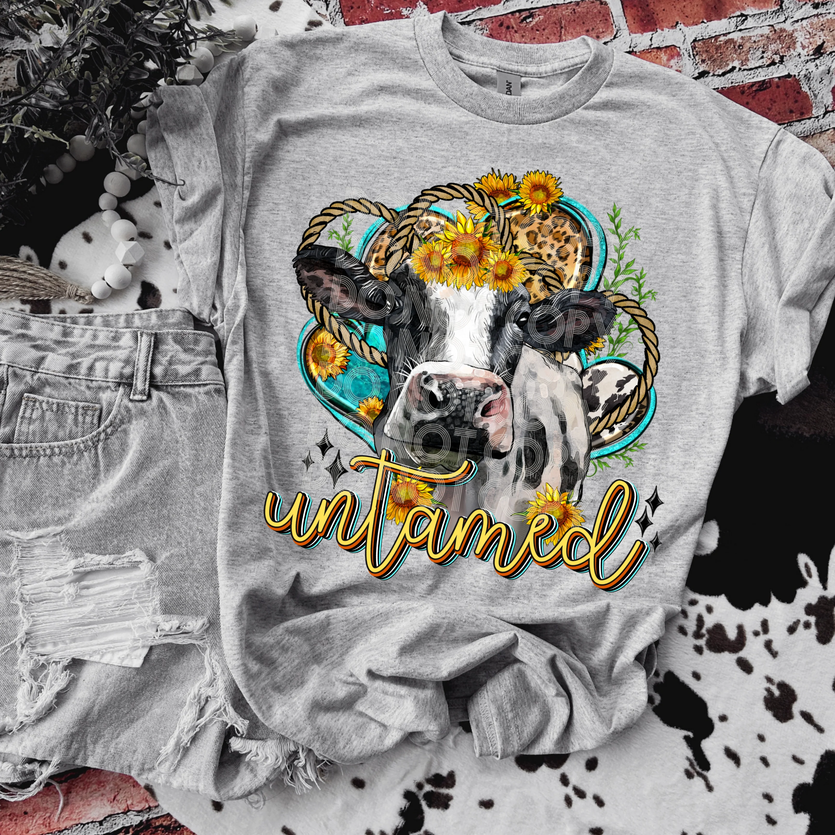 UNTAMED FLORAL COW TEE